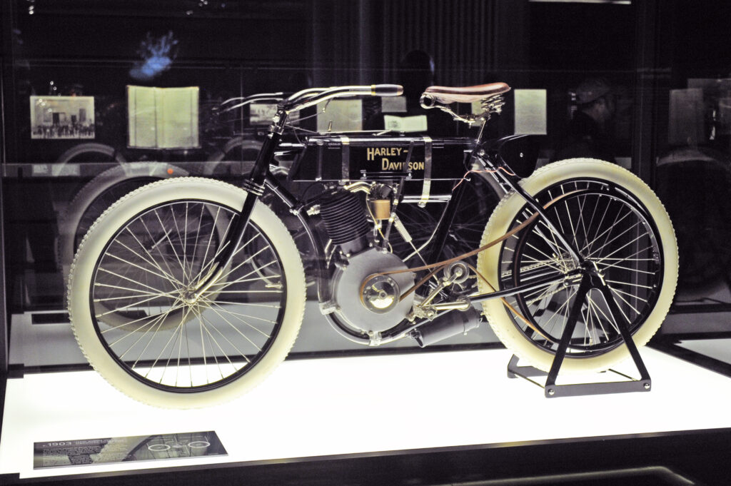 Vintage motorcycle in museum case.