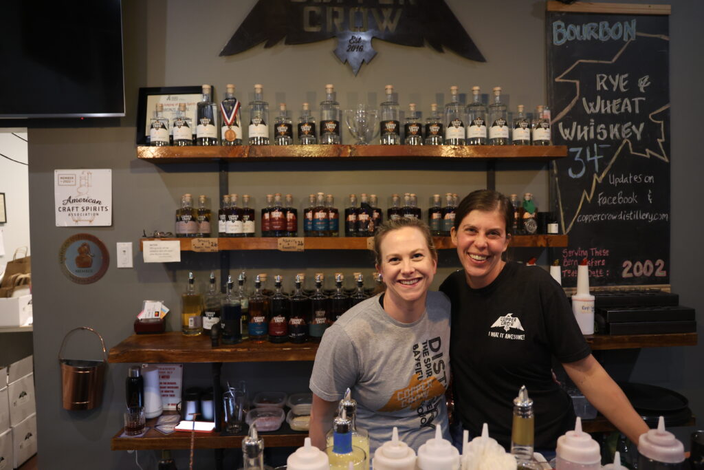 Bartenders behind the bar.