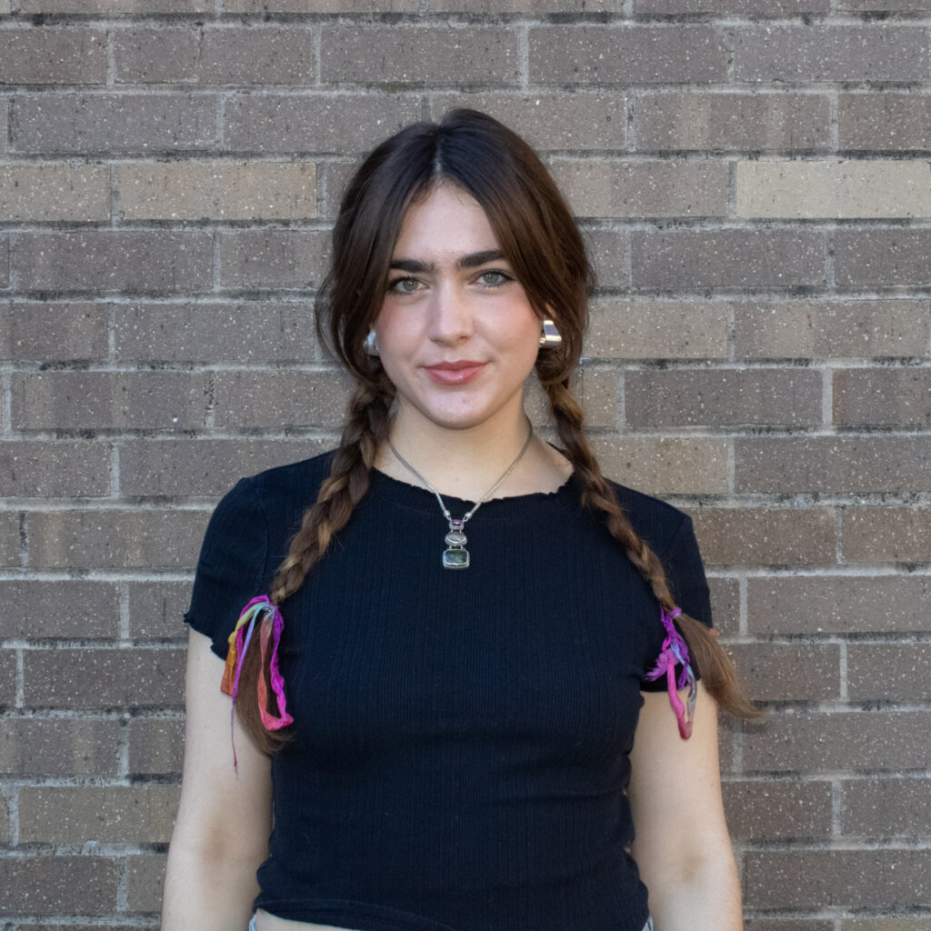 Woman smiles for portrait.